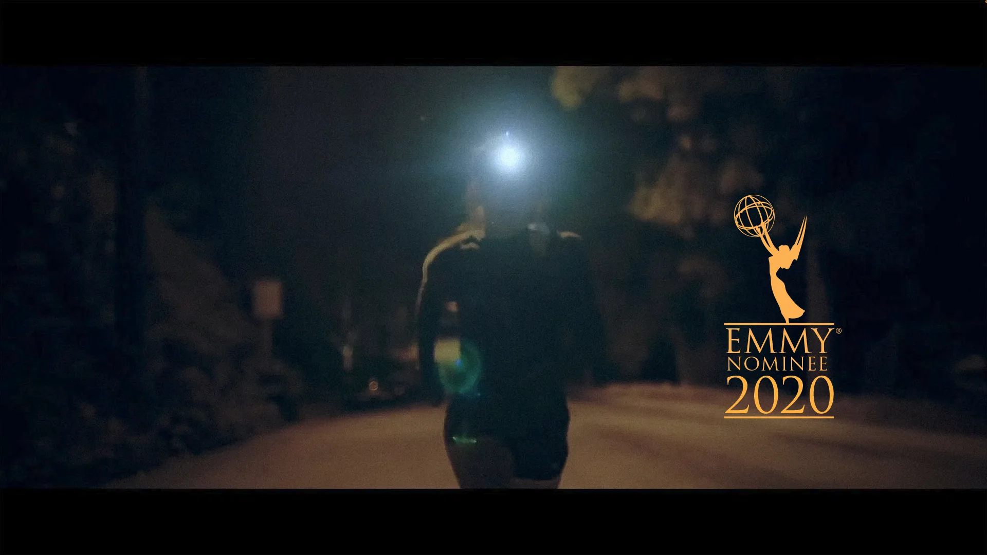 Harriet runs through the dark in the early morning before her bakery shift, her headlamp shining brightly toward the camera. An Emmy Nominee 2020 badge appears on the right.